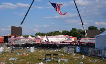 A campaign rally site for former President Donald Trump is empty and littered with debris Saturday