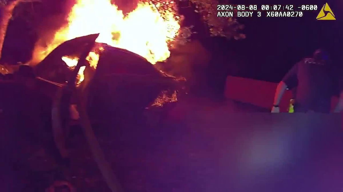 <i>KSTU via CNN Newsource</i><br/>Newly-released body camera video shows the efforts made by police officers to save a driver from being burned alive following a late night crash.