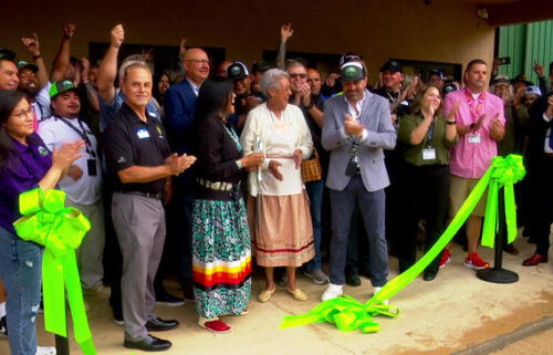 A ribbon-cutting ceremony is held outside the Great Smoky Cannabis Dispensary in Cherokee