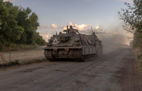 Ukrainian servicemen operate an armored military vehicle in the Sumy region near the border with Russia on August 12.