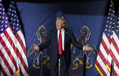 Former President Donald Trump arrives to speak at a campaign rally in Harrisburg