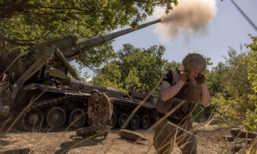 Ukrainian servicemen fire artillery toward Russian positions in an undisclosed area in the Pokrovsk district of Ukraine.