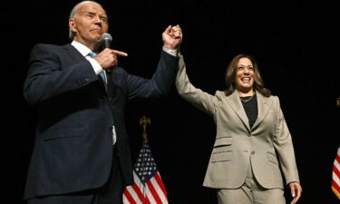 President Joe Biden points to Vice President and Democratic presidential candidate Kamala Harris after they spoke at Prince George's Community College in Largo