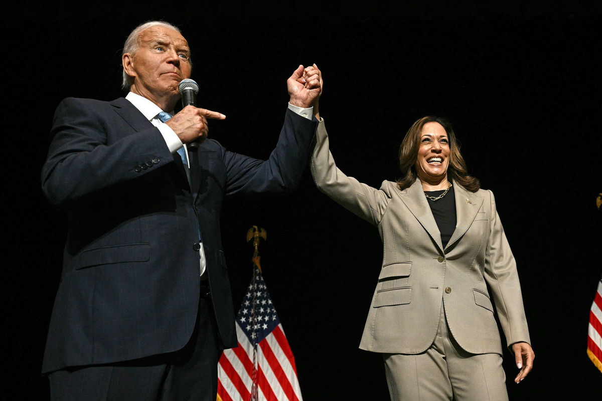 <i>Brendan Smialowski/AFP/Getty Images via CNN Newsource</i><br/>President Joe Biden points to Vice President and Democratic presidential candidate Kamala Harris after they spoke at Prince George's Community College in Largo