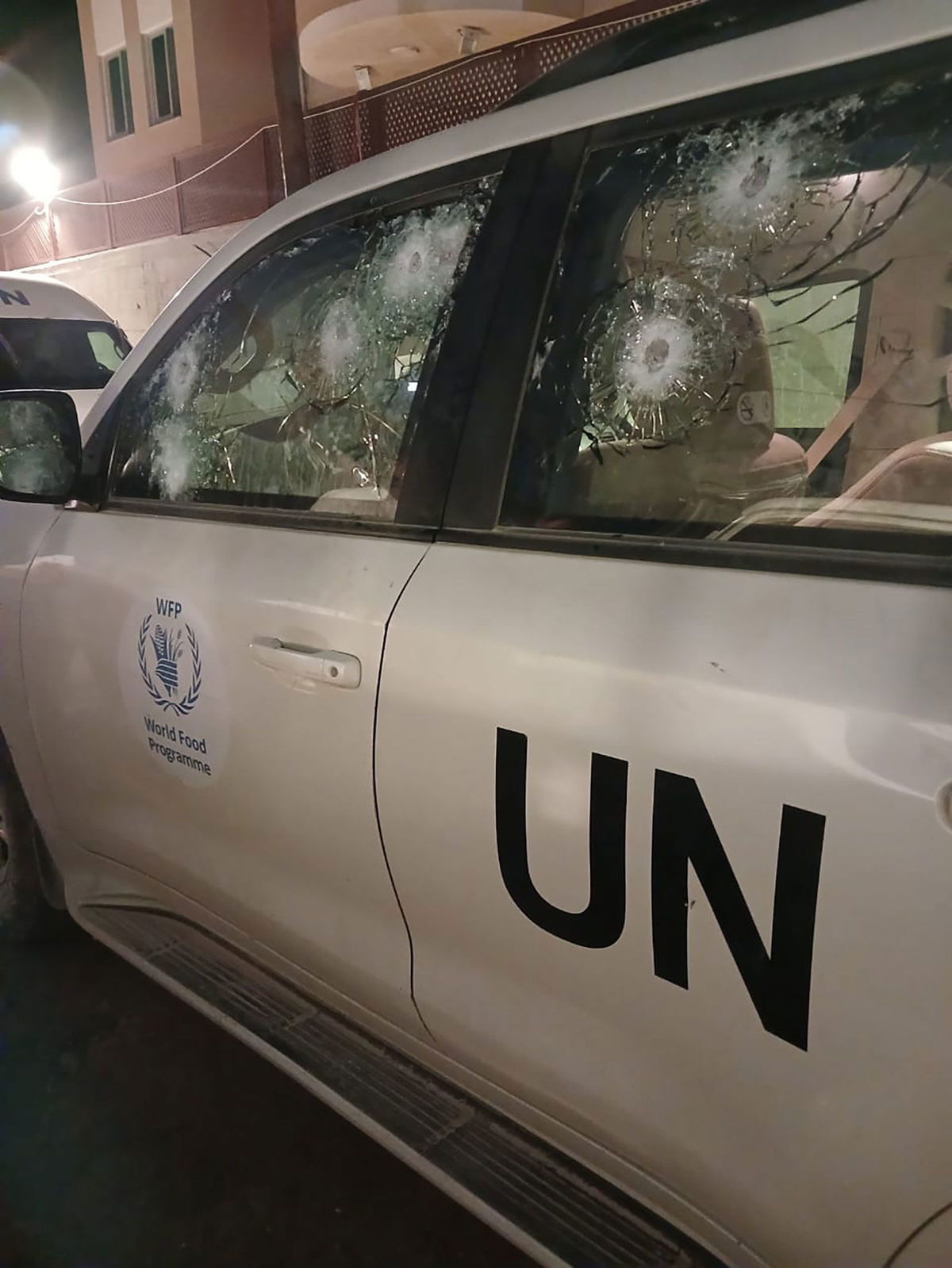 <i>World Food Program via CNN Newsource</i><br/>A photo released by the World Food Program shows multiple bullet marks in the driver's side window; in total