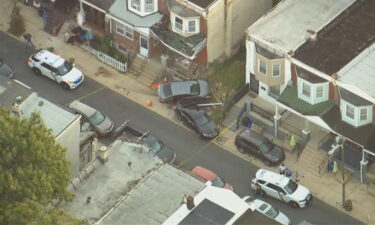 Philadelphia police are searching for three men who they say stole a car at gunpoint and then crashed it into a home in West Philadelphia.