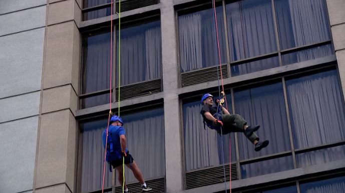 <i>WLOS via CNN Newsource</i><br/>Over the Edge' hosted a rappelling event at the Renaissance Hotel in downtown Asheville on Labor Day to raise money for North Carolina Special Olympics.