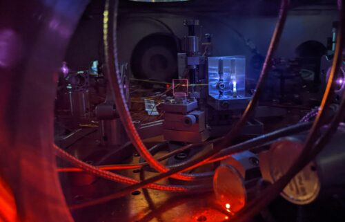 Scientists measure the frequency of energy pulses affecting an atom's nucleus by counting the waves in the UV signal. Wavelengths that can induce a nucleus transition oscillate at higher frequencies