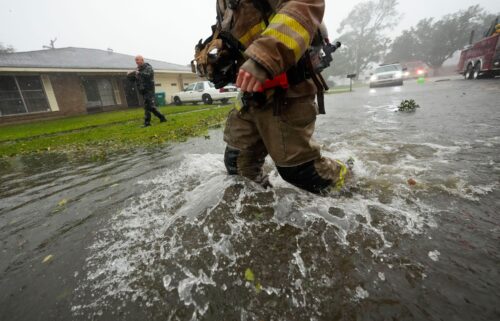 Morgan City firefighters respond to a home fire during Hurricane Francine in Morgan City