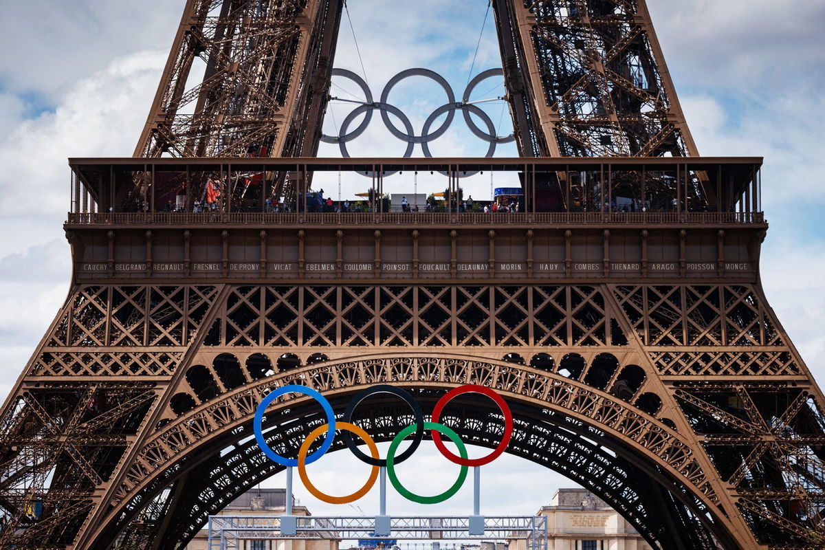 Medallists parade in front of the Eiffel Tower during the Games.