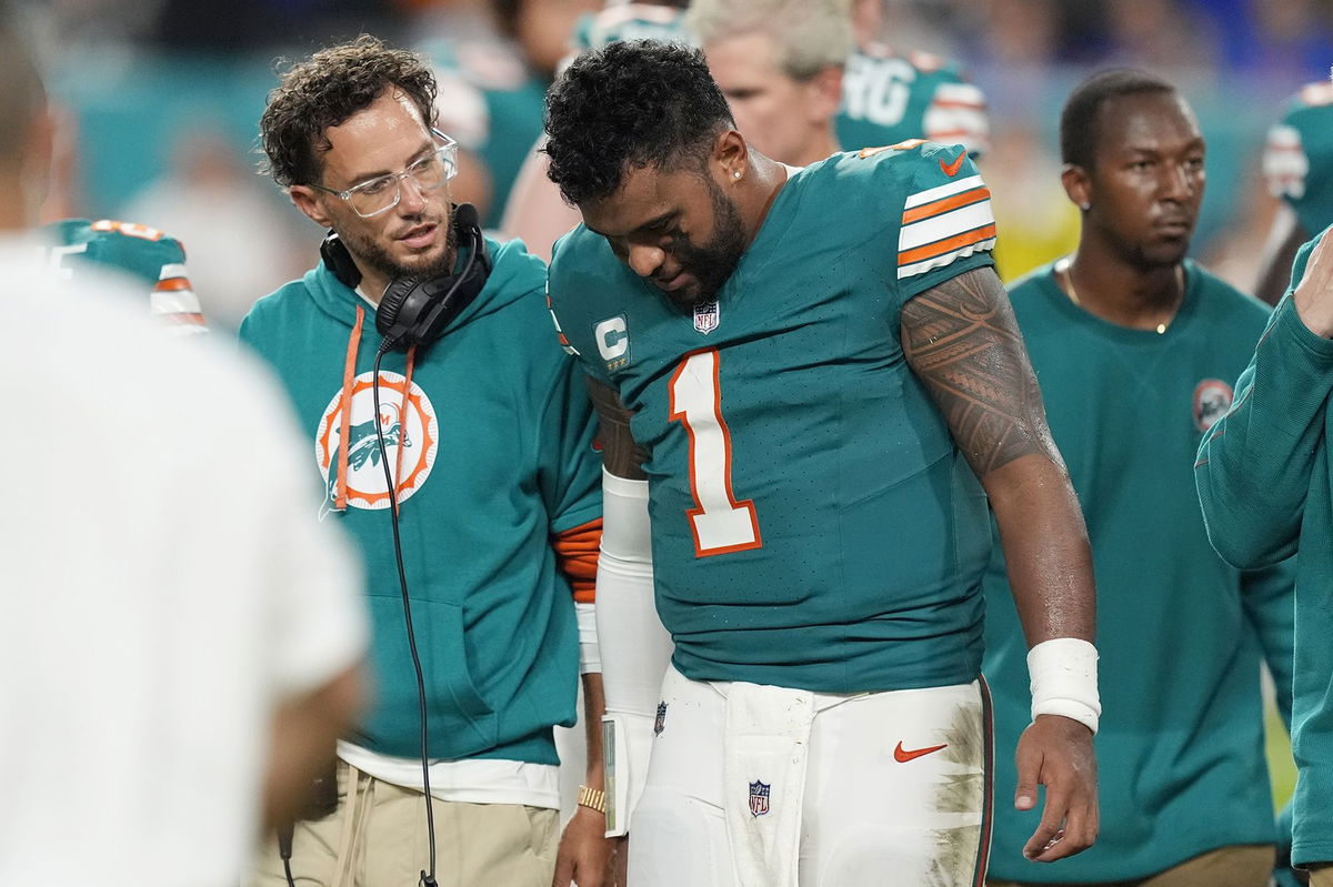 <i>Rebecca Blackwell/AP via CNN Newsource</i><br/>Tua Tagovailoa leaves the Dolphins' game against the Buffalo Bills after suffering a concussion.