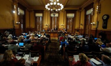 Georgia's State Election Board members discuss proposals to a full room for election rule changes at the Georgia State Capitol in Atlanta on September 20.