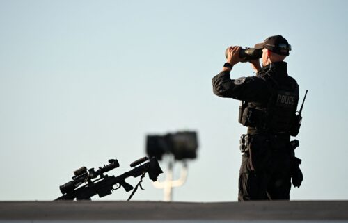 A Secret Service sniper team member stands guard as he waits for Donald Trump to arrive at Philadelphia International Airport in Philadelphia