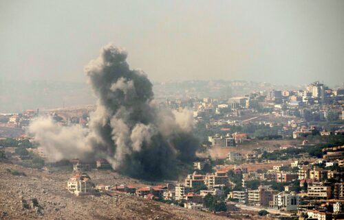 Smoke rises from Israeli airstrikes in the village of Kfar Rouman