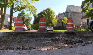 Residents are fighting to not fix but instead to preserve a massive hole in the middle of their road.