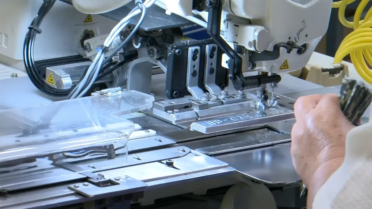 A worker using a machine in the ReadyOne Industries facility in El Paso 