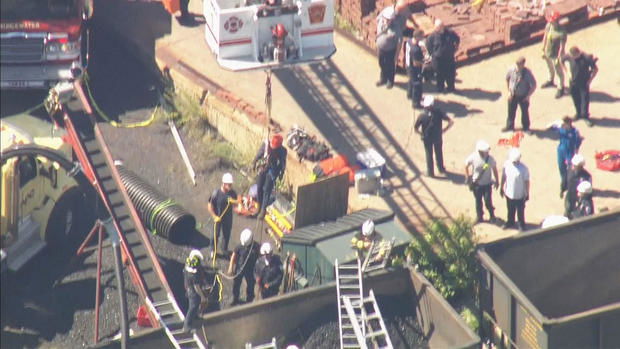 <i>WBZ via CNN Newsource</i><br/>Crews pulled a man to safety after he was trapped in coal train car in Bridgewater.