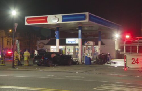 The man driving the vehicle that crashed into the pumps was said to be fighting with officers in the street. A police officer was taken to the hospital to be treated for a hand injury.