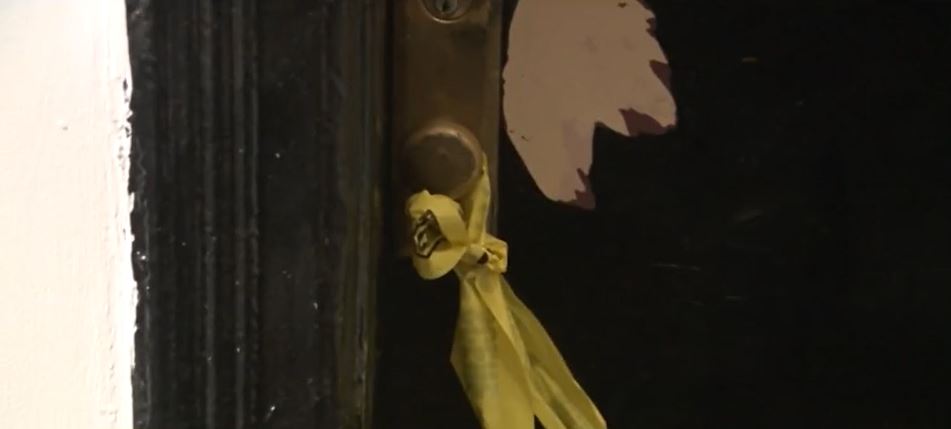 <i>WCBS/WLNY via CNN Newsource</i><br/>Yellow police tape covered the front door to the apartment at 2484 Adam Clayton Powell Jr. Boulevard on Monday