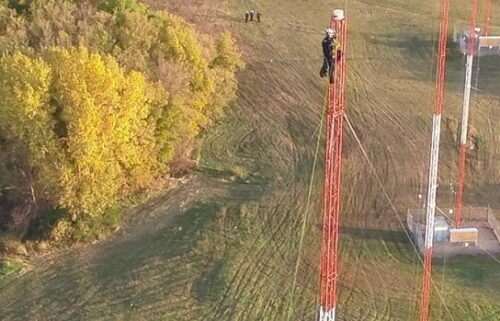 Video captured rescuers climbing 250 feet up a radio tower to make a sky-high save in the south metro.