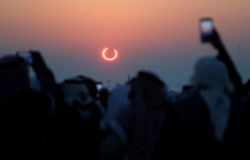 A global map shows the path of the annular solar eclipse on October 2.