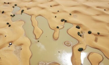 Buildings along a lake filled by heavy rainfall are pictured in the desert town of Merzouga on October 2.