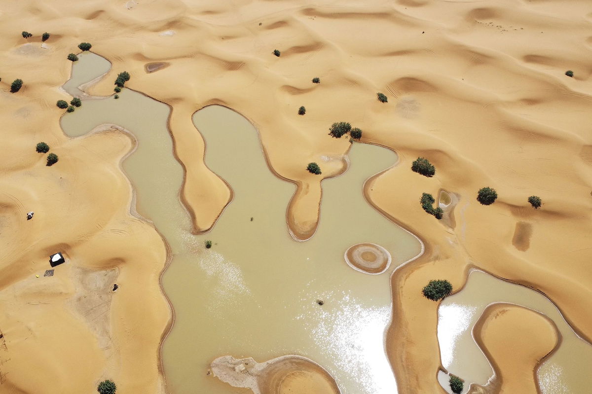 <i>AP via CNN Newsource</i><br/>Buildings along a lake filled by heavy rainfall are pictured in the desert town of Merzouga on October 2.