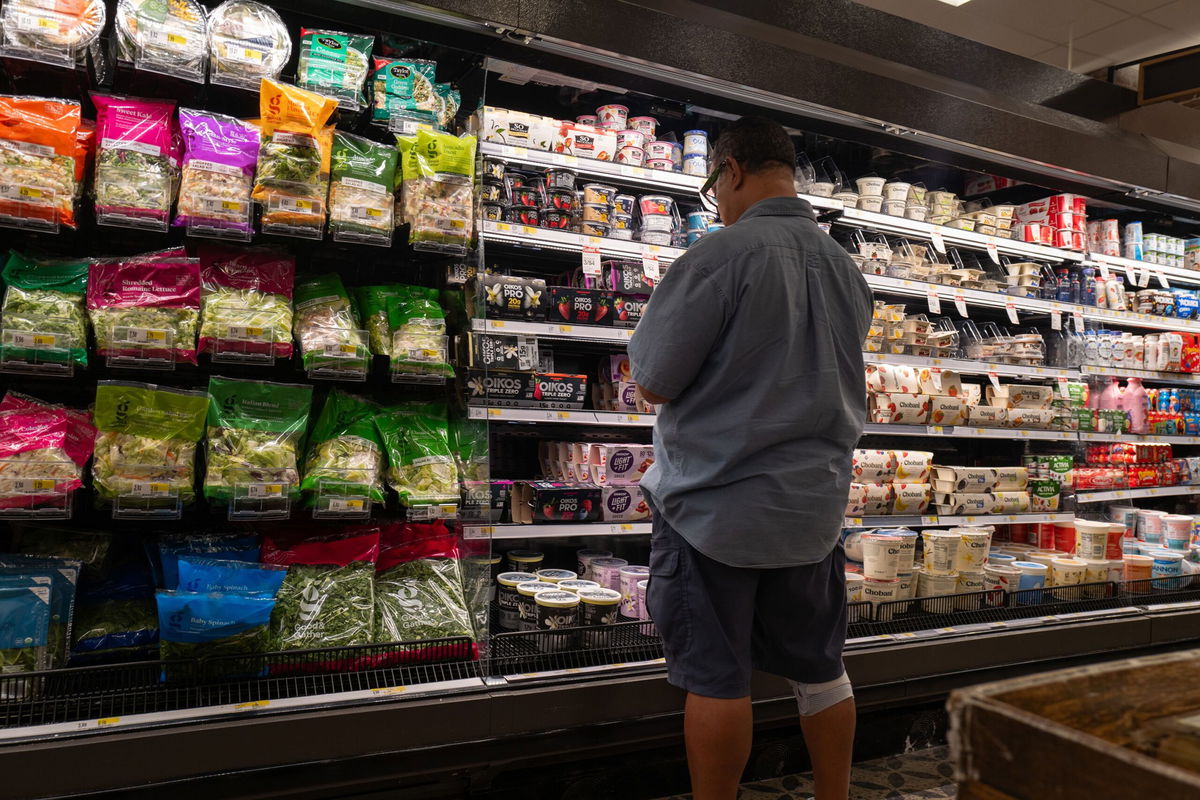 <i>Spencer Platt/Getty Images via CNN Newsource</i><br/>A customer shops at a store in Brooklyn on August 14