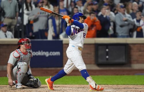 New York Mets owner Steve Cohen celebrates with shortstop Francisco Lindor after defeating the Philadelphia Phillies in game four of the NLDS.