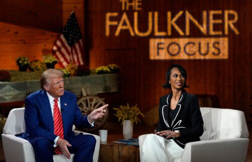 Former President Donald Trump speaks during a break at a Fox News town hall with moderator Harris Faulkner in Cumming