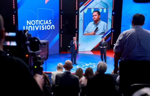 Former President Donald Trump answers a question as moderator Enrique Acevedo looks on during a Univision Noticias town hall event on October 16 in Doral